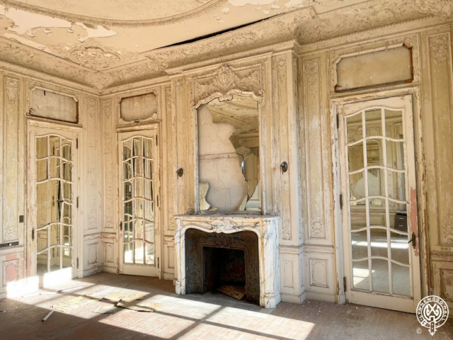 Bedroom of George and Eleanor Widener in Lynnewood Hall, stunning all white Louis XV style bedroom featuring gorgeous white marble mantel, mirrored door panels skirt the bedroom.